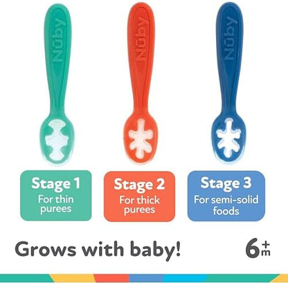 Flexible food grade silicone baby spoons being held to demonstrate the soft material