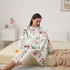 Mother using Insular nursing cover for discreet public feeding