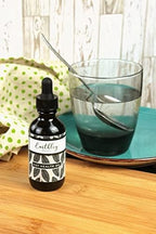 Earthley Wellness Gut Health Oil lifestyle flat lay
