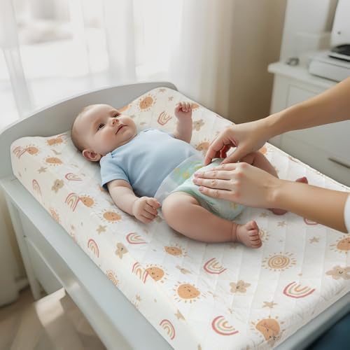 Unicorn Castle brown rainbow changing pad cover fitted on a standard nursery mattress
