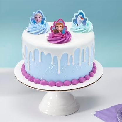 Close up of Elsa and Anna character rings for cake decoration