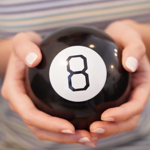MystiCabin 8 ball held in hand for size perspective