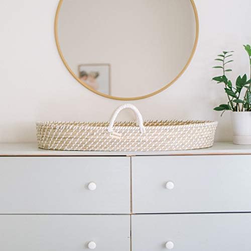 Design Dua newborn wicker changing station showing interior pad liner