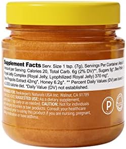 BeeKeeper's Naturals B.Powered superfood honey jar showing natural texture and ingredients list for energy support.