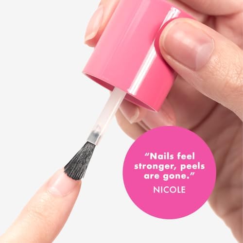 Olive and June nail strengthener bottle next to application brush