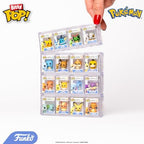 Top down view of the four Pokemon Bitty Pop collectibles in their storage case