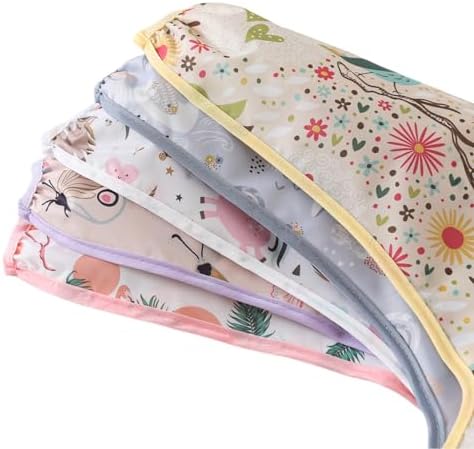 Demonstration of cleaning the water resistant fabric of the baby shirt bib by wiping it with a damp cloth.
