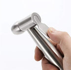Close-up view of the ergonomic thumb-trigger lever on the bidet sprayer