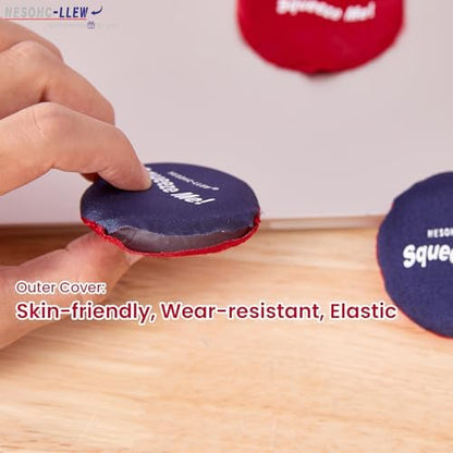 An adult hand squeezing the soft silicone stress relief toy at an office desk.
