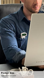 Person carrying Emopet Aibi pocket pet in hand