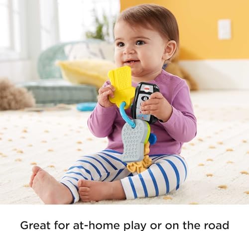 Fisher-Price baby activity toy keys illuminated to showcase the light-up feature on the fob.