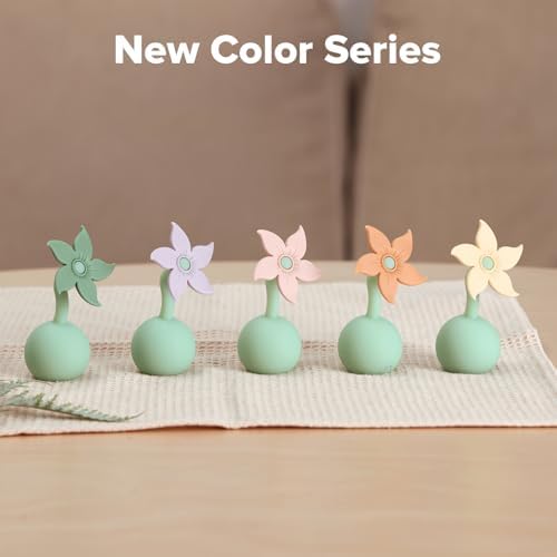 Haakaa silicone pump stopper plug in blush pink color close up view