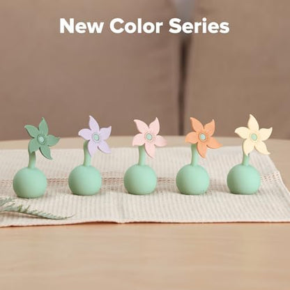 Haakaa silicone pump stopper plug in blush pink color close up view