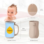 Water pouring smoothly from the twenty five fluid ounce cat beige rinse cup