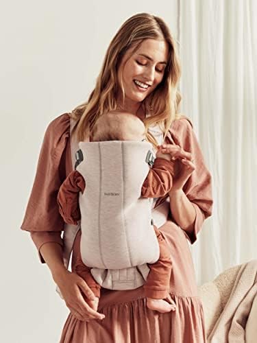 BabyBjorn carrier showing adjustable head support feature