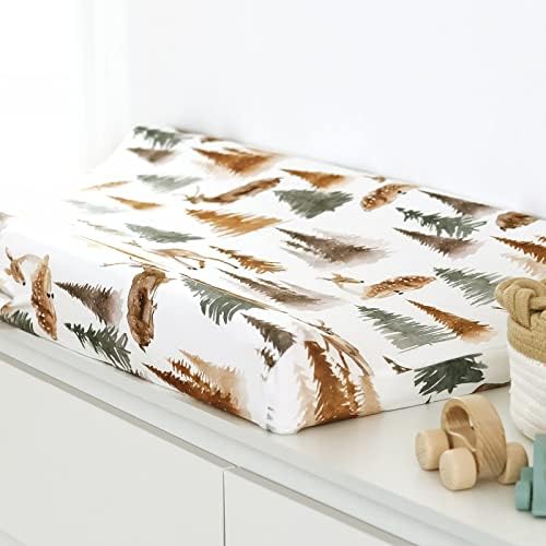 Beige botanical and white deer patterned diaper changing table sheets spread flat.
