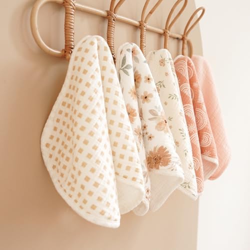 Konssy unisex infant burping cloths being used over the shoulder during baby feeding.