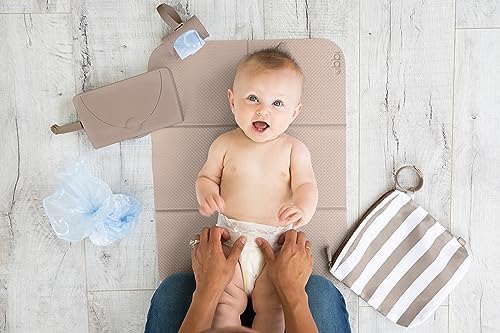 Ubbi diaper changing mat being used in a diaper bag context
