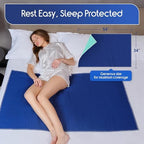 The 34 x 54 inches extra large stain hiding dark blue sheet protector laid out on a bed.