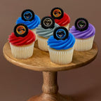 Colorful monster truck ring decorations on cupcakes