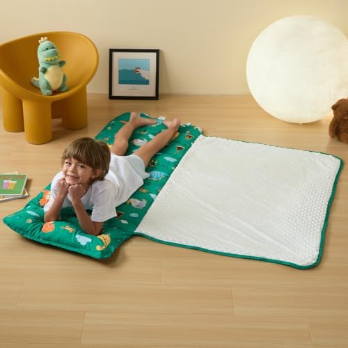 Beeweed dinosaur toddler mat being carried by the integrated shoulder strap