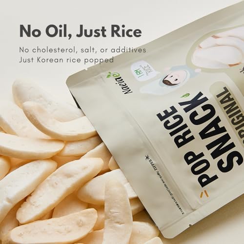 Close up view of the oval shaped gluten free popped rice snack pieces designed for toddler hands.