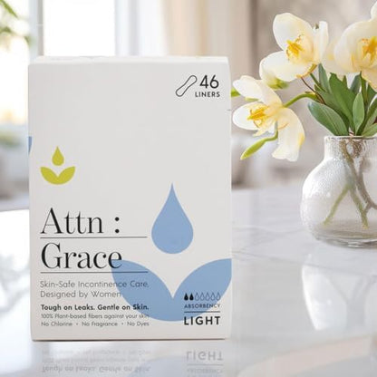 Attn: Grace hypoallergenic daily personal care liners showing the disposable protective backing sheet.