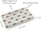 Tewrnvioc nursery sheet folded to highlight watercolor botanical pattern