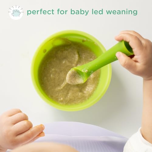 Infant holding the ergonomic sprout stem of the Olababy silicone feeding utensil