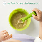 Infant holding the ergonomic sprout stem of the Olababy silicone feeding utensil