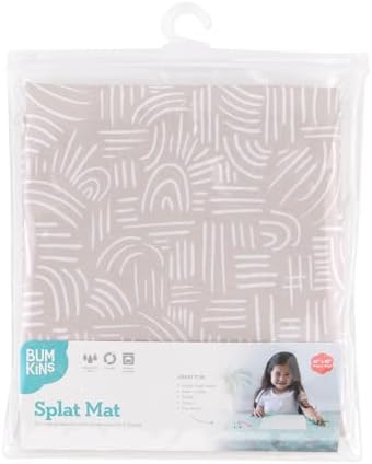 Bumkins baby mess mat spread out on the grass for outdoor toddler playtime