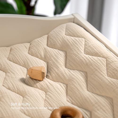 Lulumoon unisex changing pad sheet showcasing the elegant quilted zigzag pattern in a modern nursery setting.