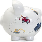 Large white construction vehicle theme money bank placed on a children bedroom shelf