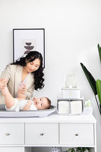 Side view of Ubbi nursery caddy with detachable storage bin