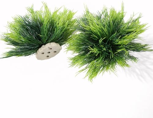 A pair of realistic green artificial bush ornaments arranged inside a freshwater aquarium display