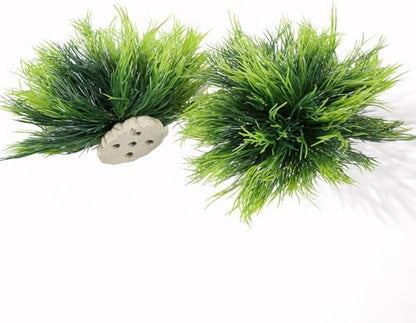A pair of realistic green artificial bush ornaments arranged inside a freshwater aquarium display