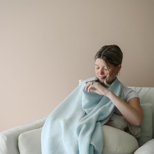 Snuggle Me nursing cover being used as a stroller sun shade