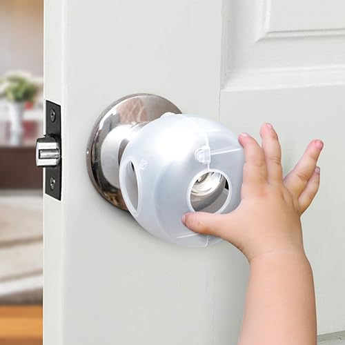 White plastic toddler safety handle lock cover installed on a bedroom door