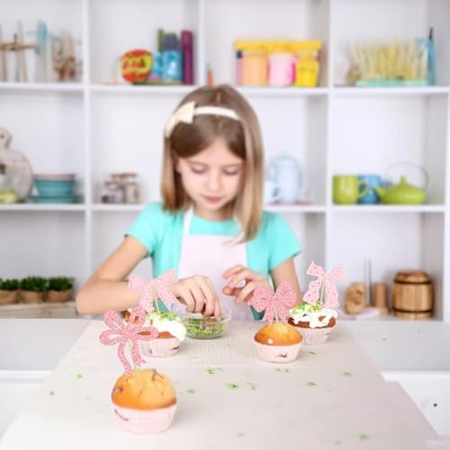 Close up of pink bow birthday party supplies