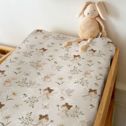 Side angle view of the elasticized fit on a standard 32 by 16 inch changing table pad.