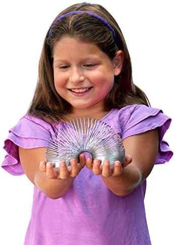 Silver metal classic walking spring toy compressed showing two point seventy five inch diameter.