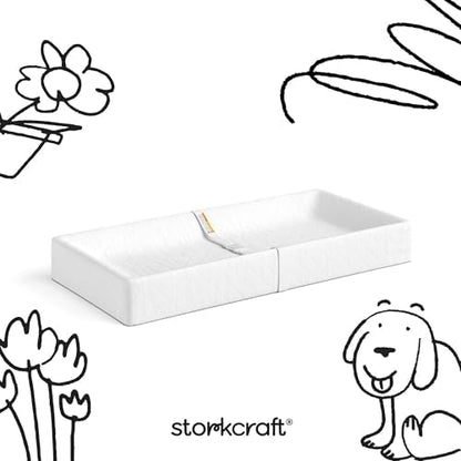 Storkcraft Nest changing pad on changing table topper
