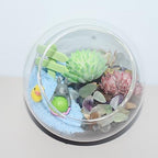 Small glass vase filled with decorative colorful stones