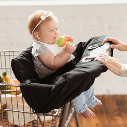 Binxy Baby black cushy cover folded compactly inside its built-in travel storage pouch
