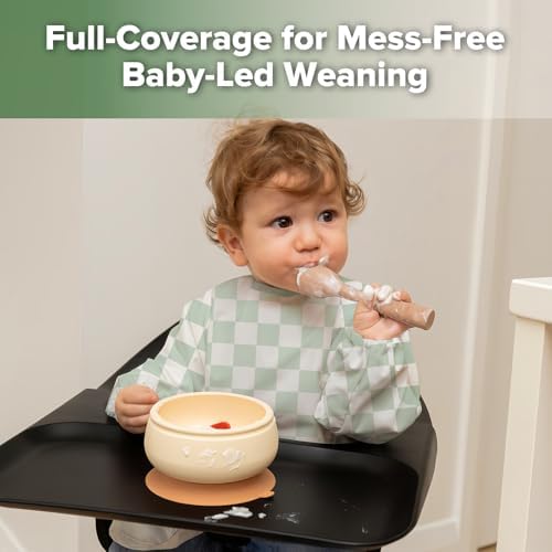 Haakaa waterproof baby smock bib showing the adjustable neck closure design