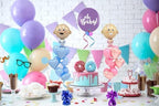 A stylized lifestyle display showing how the shiny white balloon anchors stand out on a retail gift shop display table.