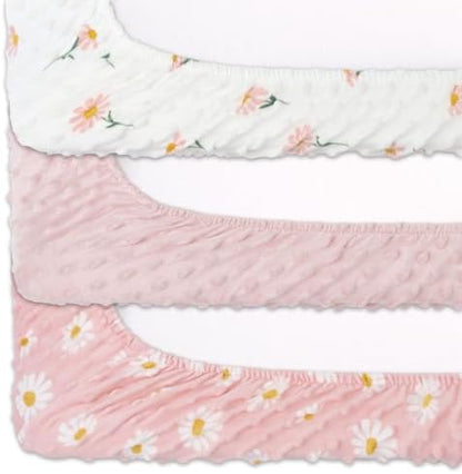Top view of pink and white daisy pattern minky changing pad sheets