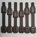 Complete set of eight brown baby proofing cabinet locks with packaging details