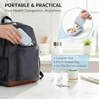 E Chu compact black pill cutting tool next to a hand showing its travel friendly dimensions.
