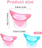 Pink and blue silicone eye bath cups for soothing tired eyes.